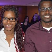 Two alumni smile for a photo together at the Chicago Alumni Reception